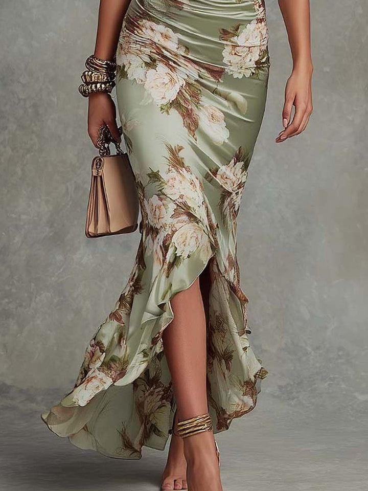 Anna - Asymmetrical long dress in green with V-neck, flared puff sleeves, and floral pattern